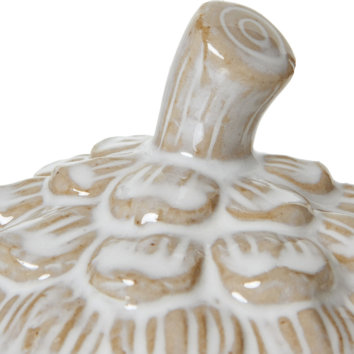 Close-up of the Hill Interiors Medium Ceramic Pine Cone Trinket Dish lid, showing the stem finial and overlapping scale detail in white glaze over beige.