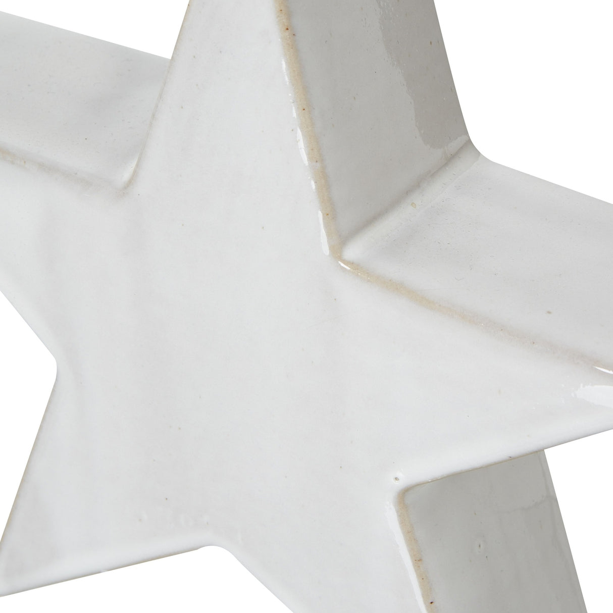 Close-up of the Hill Interiors Large Ceramic Standing Star Decoration in white, showing its smooth matte finish and angled points against a plain background.