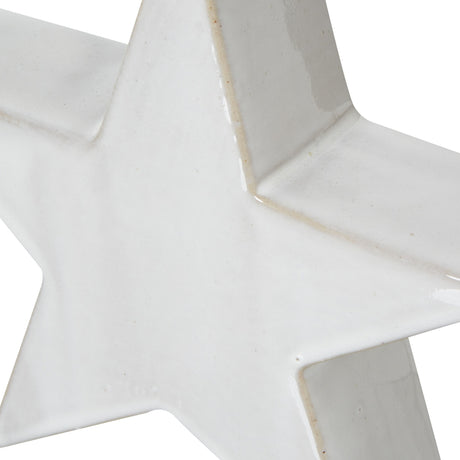 Close-up of the Hill Interiors Large Ceramic Standing Star Decoration in white, showing its smooth matte finish and angled points against a plain background.