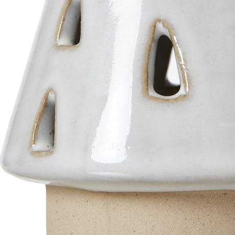 Close-up of Hill Interiors Small White Ceramic Cut-Out Tree with teardrop openings and glossy white glaze over an unglazed base.