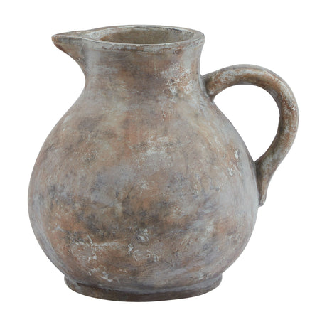 Hill Interiors Ceramic Jug in brown with a rounded body, shaped pouring lip, curved handle and weathered glaze finish, shown on a plain white background.