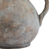 Close-up of the Hill Interiors Ceramic Jug in brown, showing its rounded body, curved handle and mottled earthy glaze against a plain background.