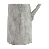 Close-up of the Hill Interiors Tall Ceramic Jug in white, showing the lower body and curved handle with a mottled glazed finish against a plain background.