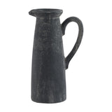 Tall ceramic jug from Hill Interiors in matt grey stoneware with a slim tapered body, poured lip and curved handle, shown on a plain background.