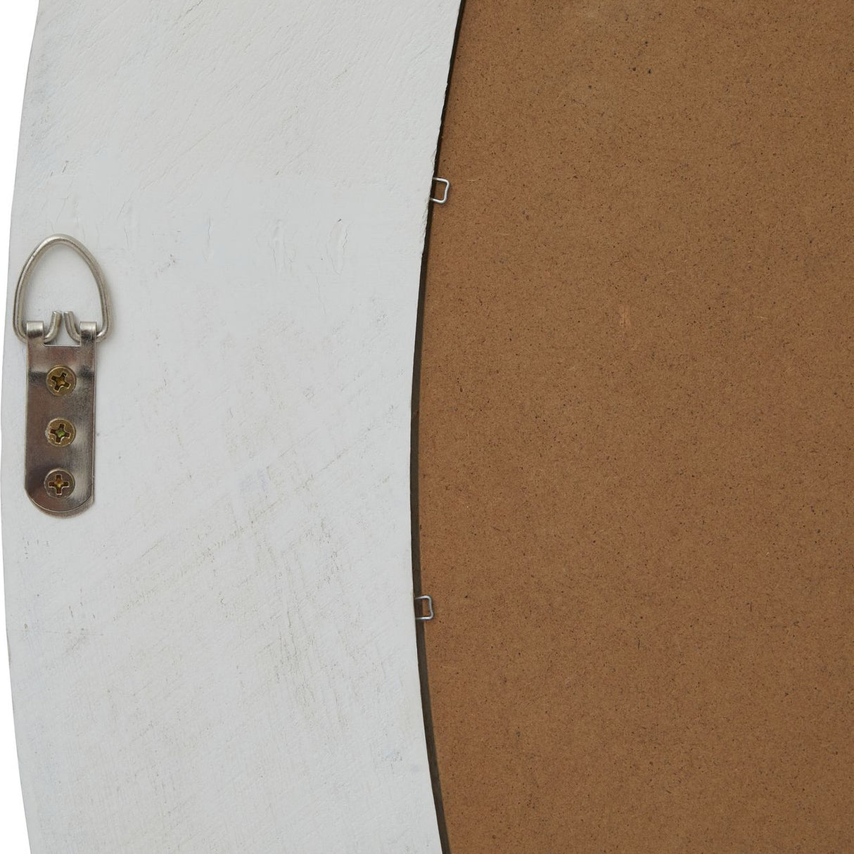 Close-up of the Hill Interiors Washed Wood Round Framed Large Mirror in white, showing the D-ring hanger and metal clips securing the brown backing board.