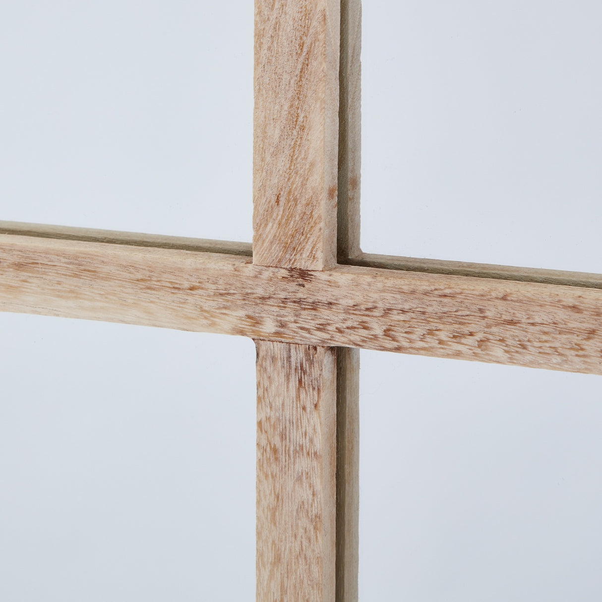 Close-up of the Hill Interiors Large Washed Wood Window Mirror in brown, showing the wooden frame's crossed glazing bars and grain on a pale background.