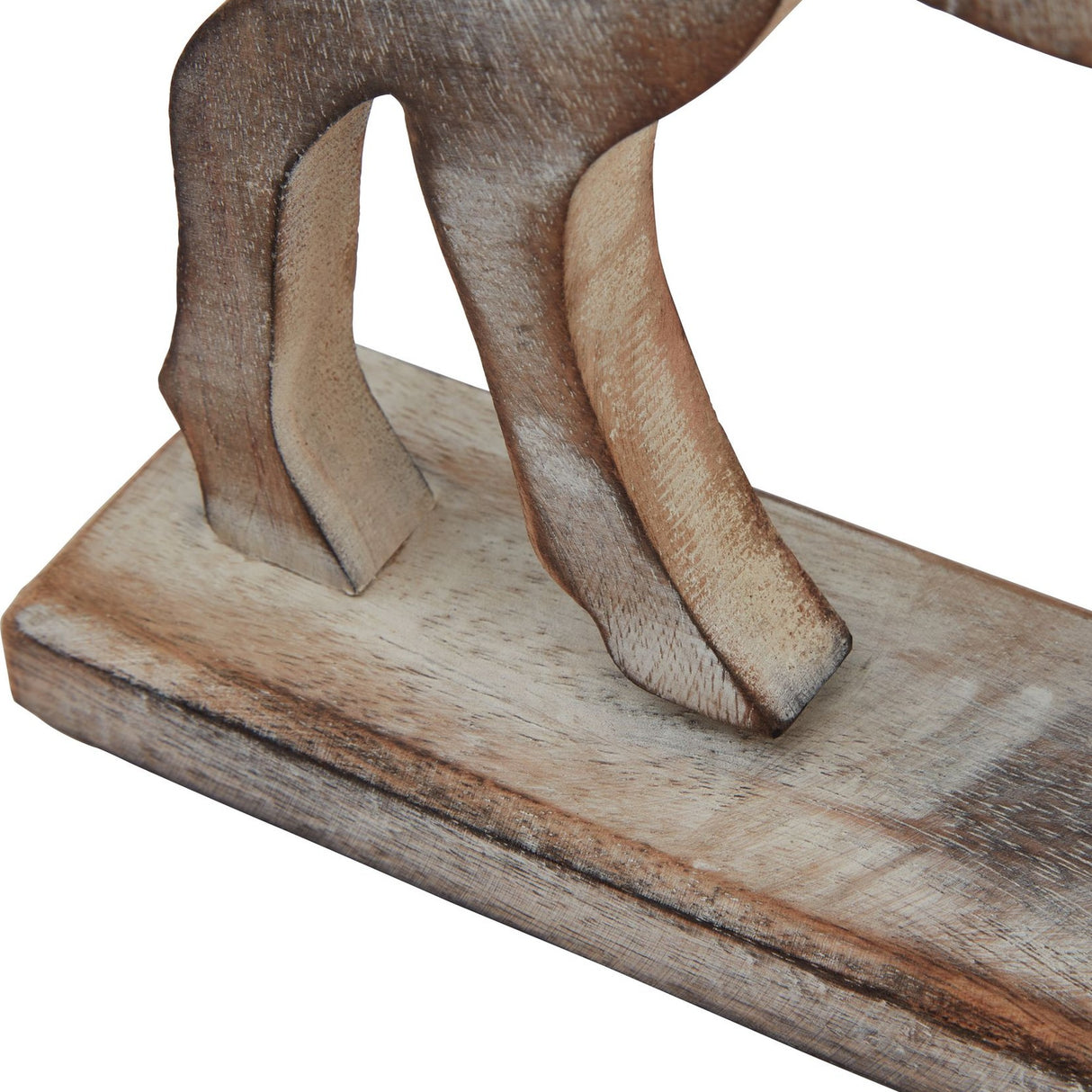 Close-up of the Hill Interiors White Wash Wooden Reindeer Decoration showing carved legs and rectangular base with visible grain and white wash finish.
