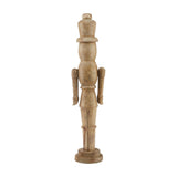 Hill Interiors wooden nutcracker Christmas decoration in beige with carved detailing and round base, shown against a plain white background.