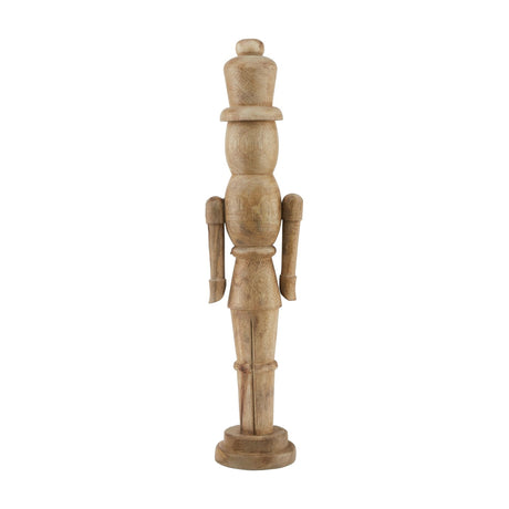 Hill Interiors wooden nutcracker Christmas decoration in beige with carved detailing and round base, shown against a plain white background.