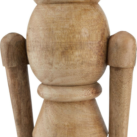 Close-up of the Hill Interiors Large Wooden Nutcracker Decoration in beige, showing the turned wood body, arms and grain detailing against a white background.