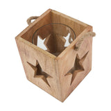 Hill Interiors wooden star tealight candle holder in beige with cut-out star motifs, glass insert and jute rope handle, shown from above on white.