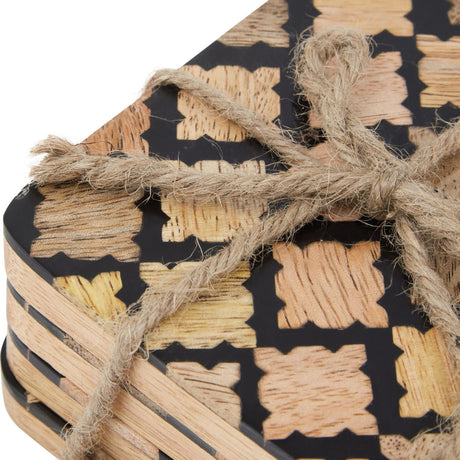 Close-up of Hill Interiors Set of 4 Wood Effect Geometric Coasters in black, tied with jute twine, showing the wood-grain cross pattern on a matte surface.