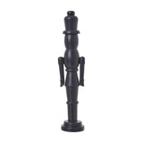 Hill Interiors Minimalist Wooden Nutcracker Decoration in matte black, a tall 50cm soldier figure with clean lines on a round base, shown on white.