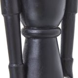 Close-up of the Hill Interiors Minimalist Wooden Nutcracker Decoration in black, showing the smooth matte torso, banded waist detail and slim arms.