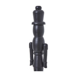Side view of Hill Interiors matte black minimalist wooden nutcracker showing its upright soldier silhouette on a white background.