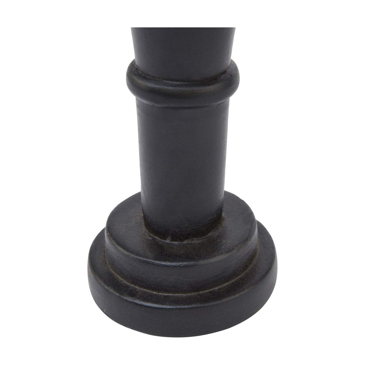 Close-up of the stepped cylindrical black wooden base of the Hill Interiors Minimalist Wooden Nutcracker Decoration, shown against a plain white background.