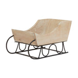 Hill Interiors wooden decorative sleigh with white wash finish over warm brown grain, set on a black metal runner base against a plain white background.