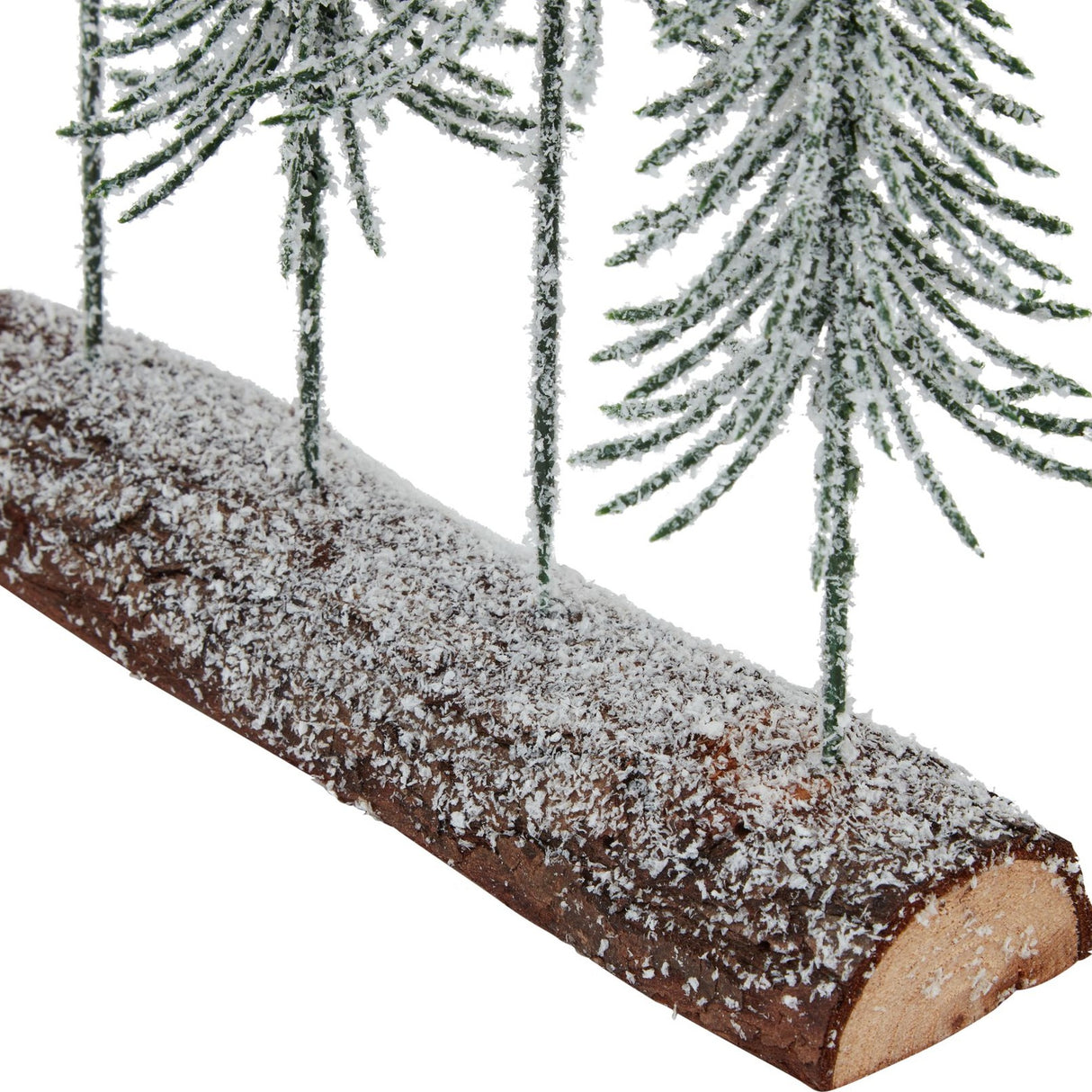 Close-up of Hill Interiors Small Snowy Spindle Tree Quad, showing frosted green spindle trees rising from a snow-dusted wooden log base.