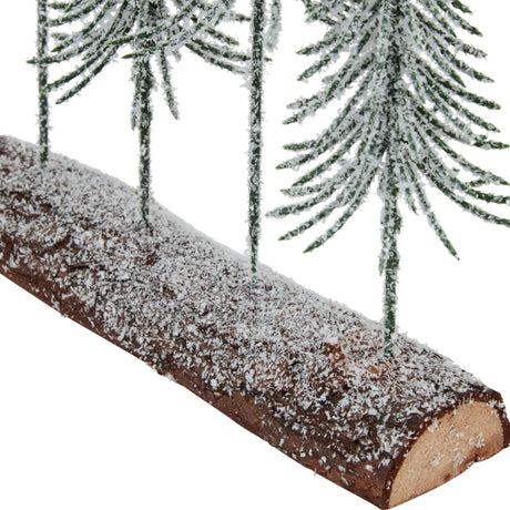Close-up of Hill Interiors Small Snowy Spindle Tree Quad, showing frosted green spindle trees rising from a snow-dusted wooden log base.