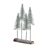 Hill Interiors Medium Snowy Spindle Tree Quad decoration with four frosted green pine trees set into a brown wooden log base, on a white background.