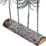 Close-up of the Hill Interiors Medium Snowy Spindle Tree Quad base, showing slender frosted trunks set into a snow-dusted brown wooden log.