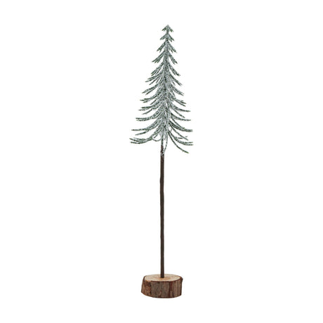 Hill Interiors Large Snowy Spindle Tree, a slim conifer form with frosted green branches set on a natural brown wood log base, shown on a white background.