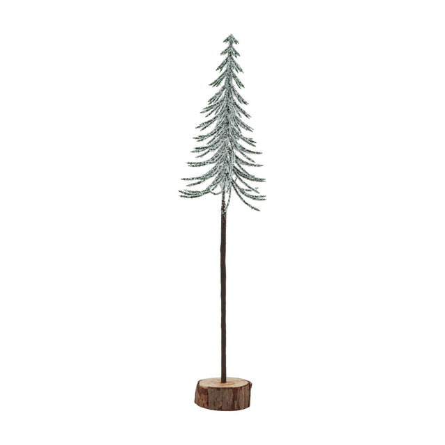 Hill Interiors Large Snowy Spindle Tree, a slim conifer form with frosted green branches set on a natural brown wood log base, shown on a white background.