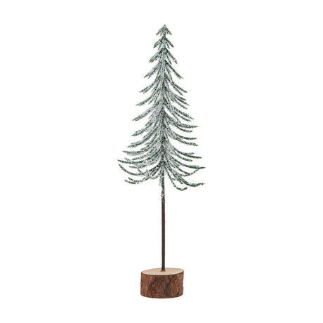 Hill Interiors Small Snowy Spindle Tree, a slim frosted green fir on a natural brown wood log base, shown against a plain white background.