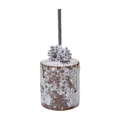 Hill Interiors Small Snowy Tree in Wood Log with frosted fir stem, pine cones and snow-dusted brown log base, shown on a plain white background.