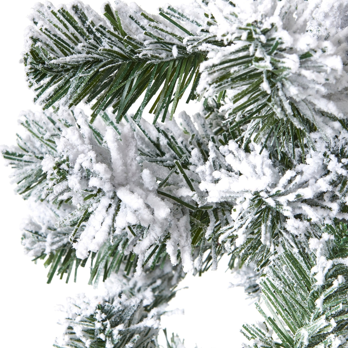 Close-up of Hill Interiors Extra Large Snowy Spruce Tree showing deep green plastic needles heavily dusted with white flocking against a plain background.