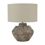 Hill Interiors Lumbriden Lekanis table lamp with a rounded brown glazed ceramic urn base and drum linen shade, shown on a plain white background.