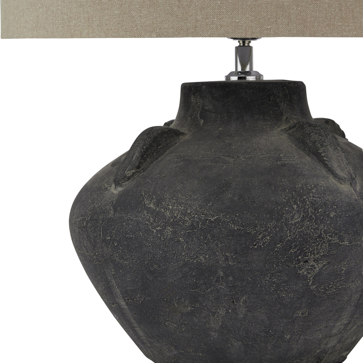 Close-up of the Hill Interiors Ferranock Lekanis ceramic table lamp showing its rounded grey chalky-glazed body and oatmeal linen drum shade base.
