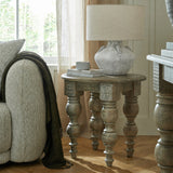 Hill Interiors Elvessa stone lekanis table lamp in beige ceramic with linen drum shade, styled on a turned-leg wooden side table beside a window.