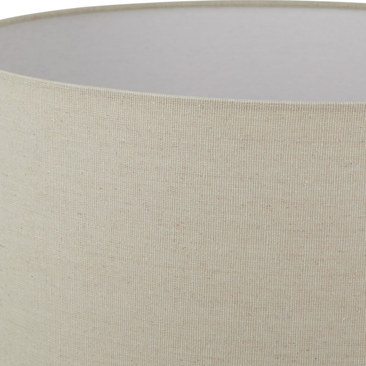 Close-up of the Hill Interiors Merenza ceramic table lamp shade in a woven cream linen-look fabric with a white inner lining.