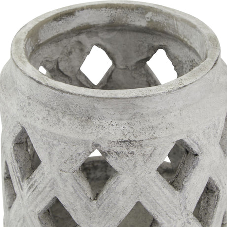 Close-up of Hill Interiors Stone Lattice Lantern Candle Holder in beige, showing the ceramic stone-effect rim and diamond cut-out pattern.