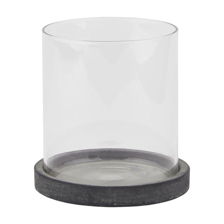 Hill Interiors grey ceramic hurricane lantern with a clear glass cylinder set on a matte grey ceramic base, shown on a plain white background.