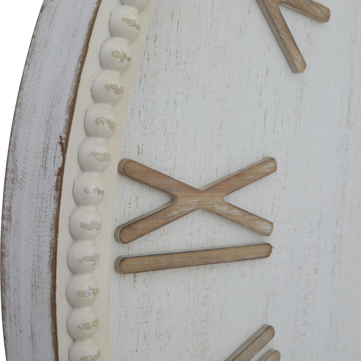 Close-up of Hill Interiors Large Rustic Beaded Frame Wall Clock in white, showing the textured beaded border and wooden Roman numerals on an aged finish.