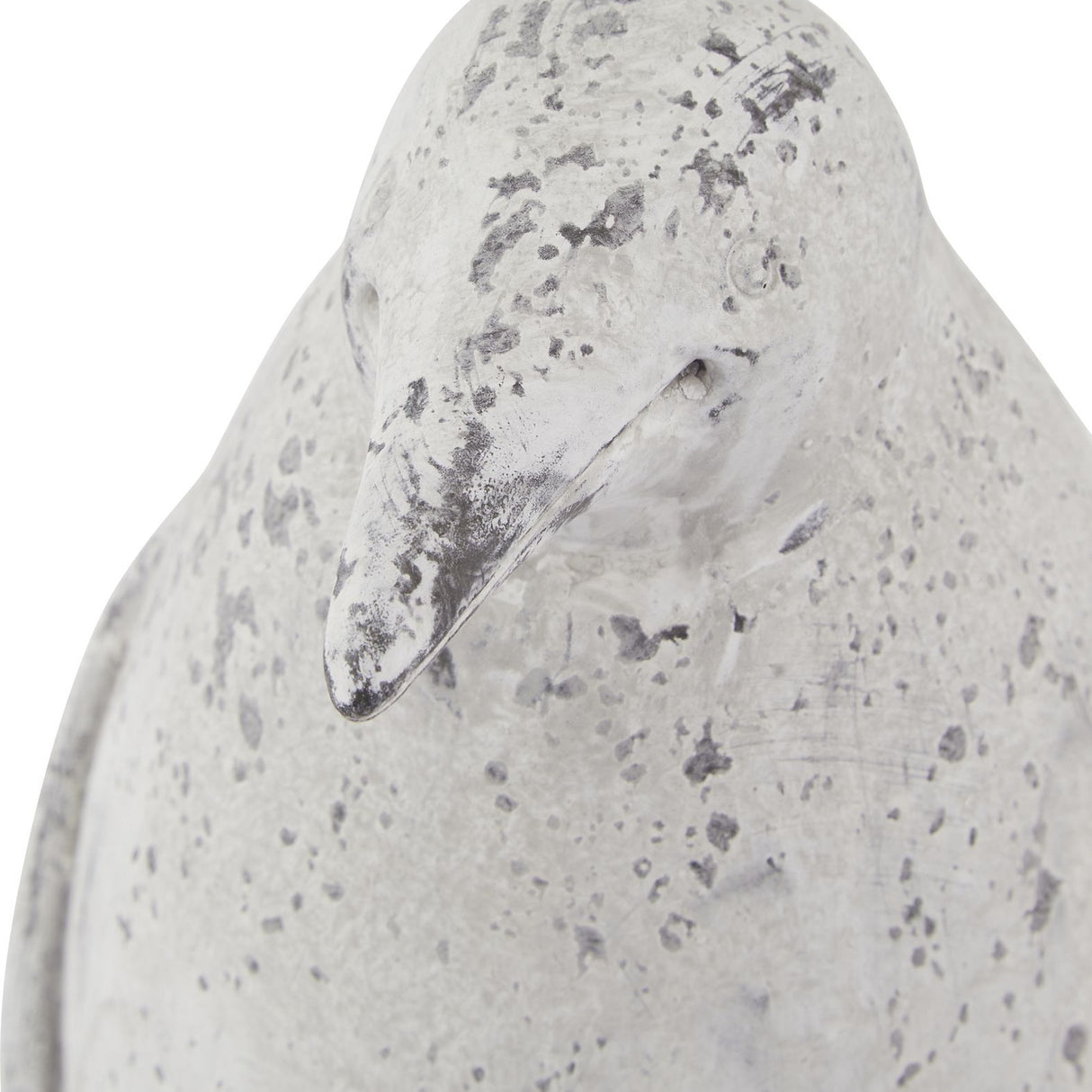 Close-up of the Hill Interiors Small Stone Effect Penguin Statue in beige, showing its ceramic beak and weathered, speckled stone-effect finish.
