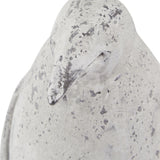 Close-up of the Hill Interiors Small Stone Effect Penguin Statue in beige, showing its ceramic beak and weathered, speckled stone-effect finish.