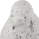 Close-up of the Hill Interiors Grey Stone Effect Penguin Statue with moulded ceramic head, slender beak, and weathered beige-grey finish on white.