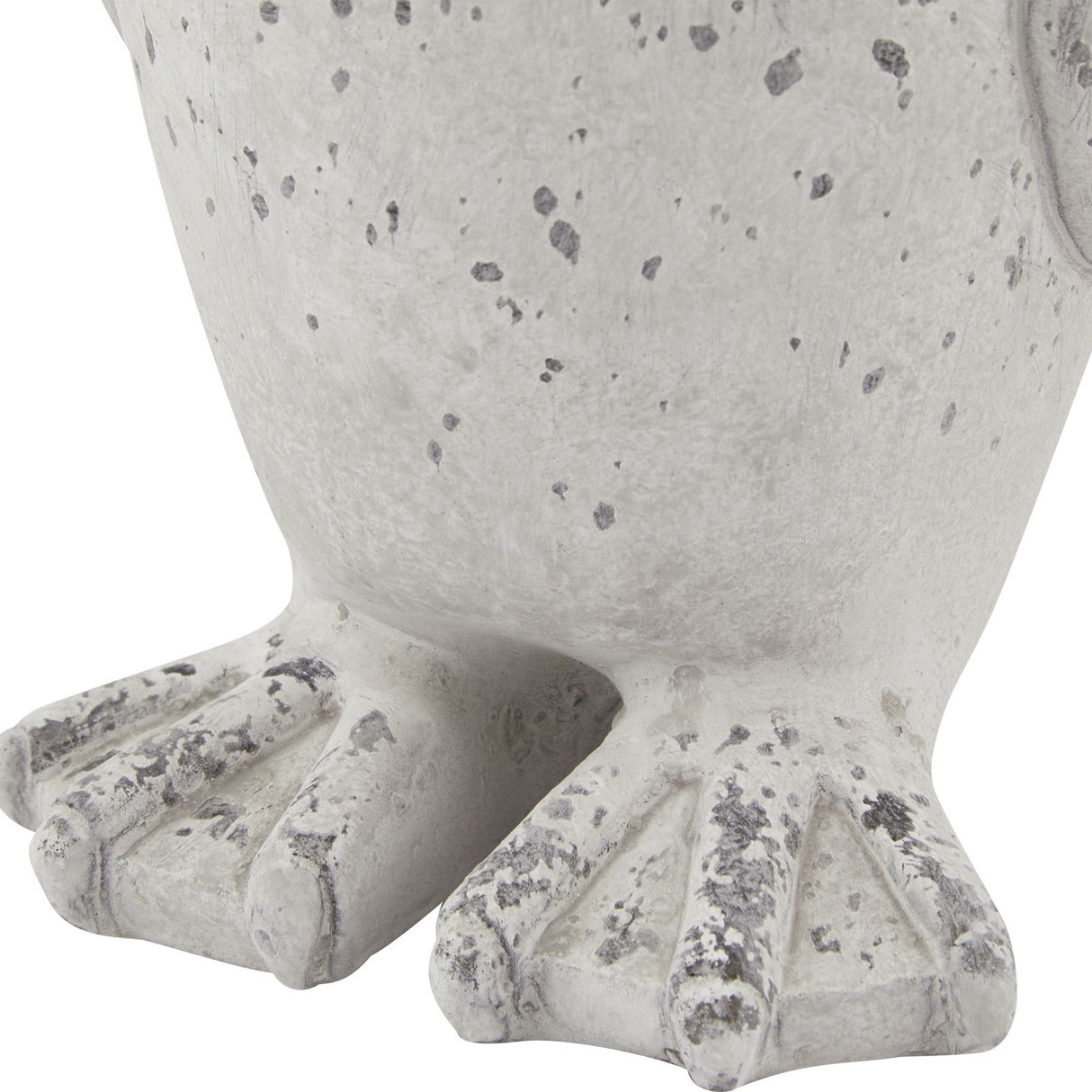 Close-up of the Hill Interiors Grey Stone Effect Penguin Statue's clawed feet, showing the weathered beige ceramic finish with dark speckling.