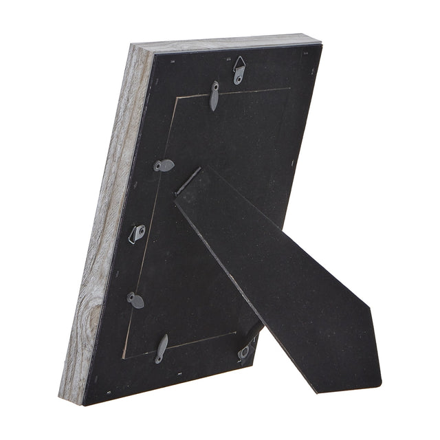 Rear view of Hill Interiors Grey Washed Wooden Photo Frame showing black backing board, metal hanging tabs and fold-out stand on a white background.