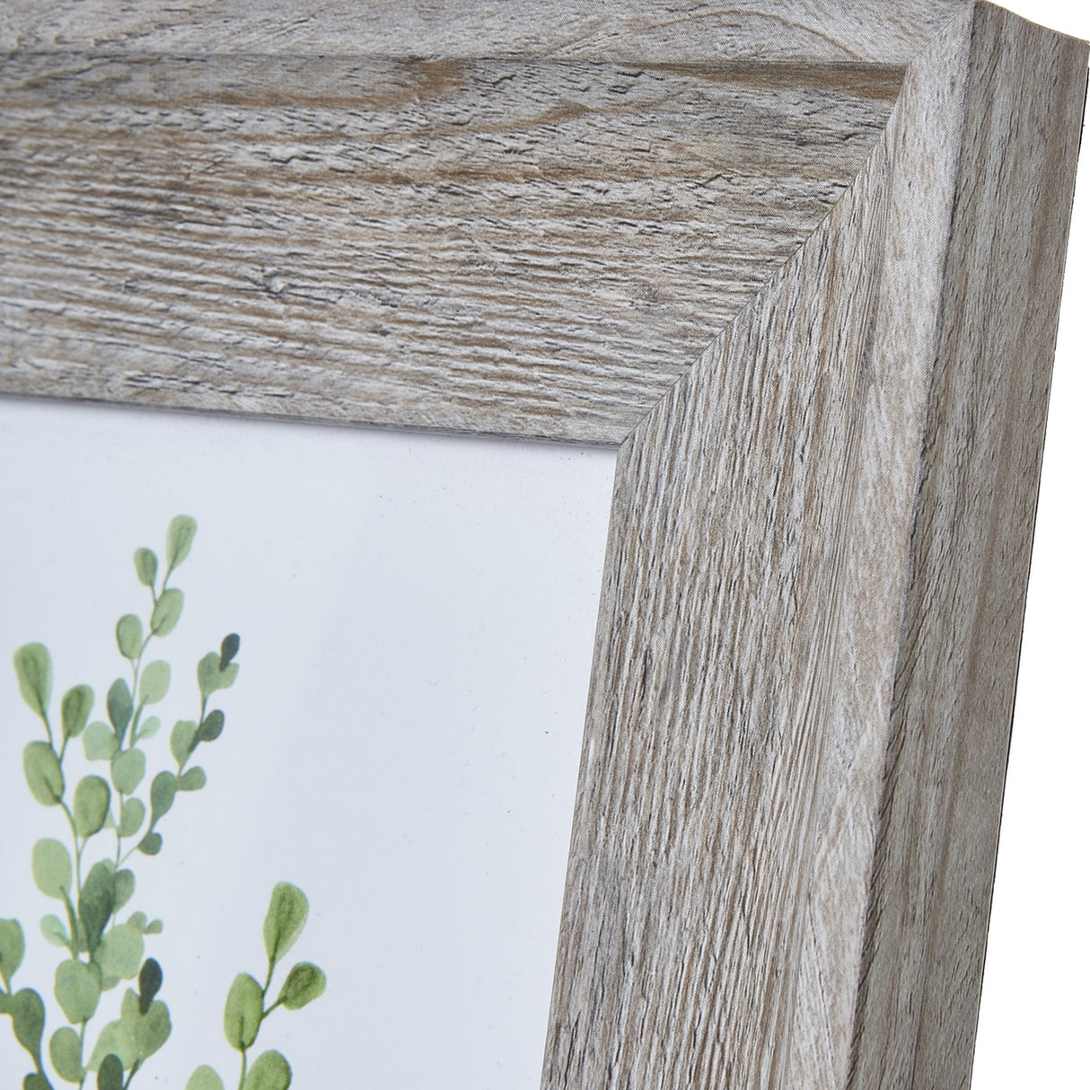 Close-up of the Hill Interiors Grey Washed Wooden Photo Frame corner, showing the flat wood moulding with visible grain and a botanical print inside.