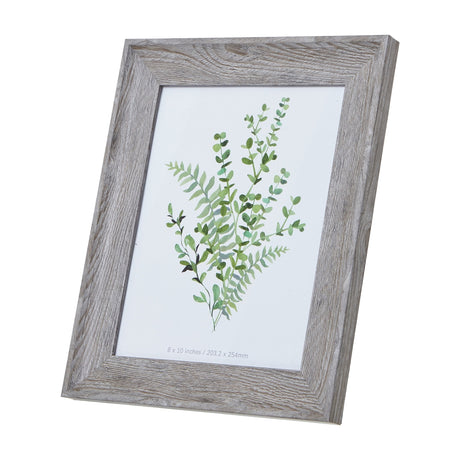 Hill Interiors grey washed wooden photo frame with an 8x10in aperture displaying a green botanical print, shown angled against a plain white background.