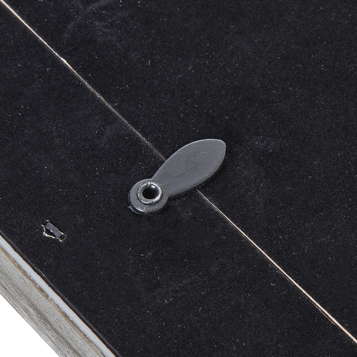 Close-up of the grey washed wooden photo frame's velvet-lined back showing the metal hanging tab from Hill Interiors.