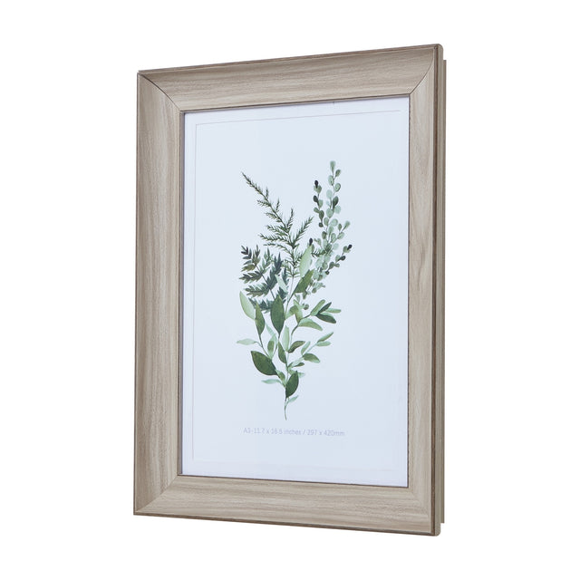 Hill Interiors white washed A3 wooden photo frame displaying a green botanical print, shown at an angle against a plain white background.