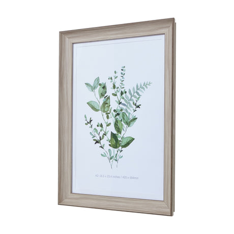 Hill Interiors White Washed Wooden A2 Picture Frame displaying a green botanical watercolour print, shown at an angle against a white background.
