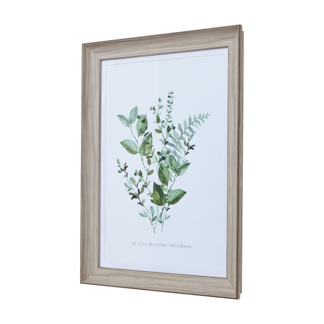 Hill Interiors White Washed Wooden A2 Picture Frame displaying a green botanical watercolour print, shown at an angle against a white background.
