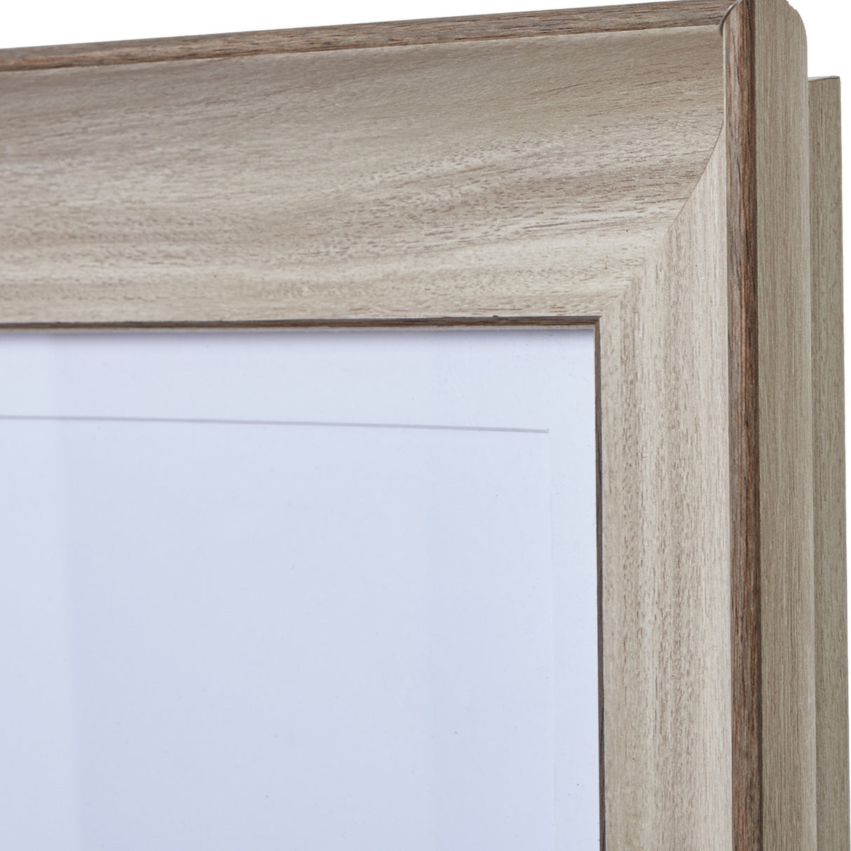Close-up of the top corner of the Hill Interiors white washed wooden A2 picture frame, showing the brushed pale finish and visible timber grain.