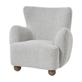 Hill Interiors Large Arm Accent Chair in greige-beige bouclé upholstery with a curved wingback silhouette and rounded wooden ball feet, on a white background.